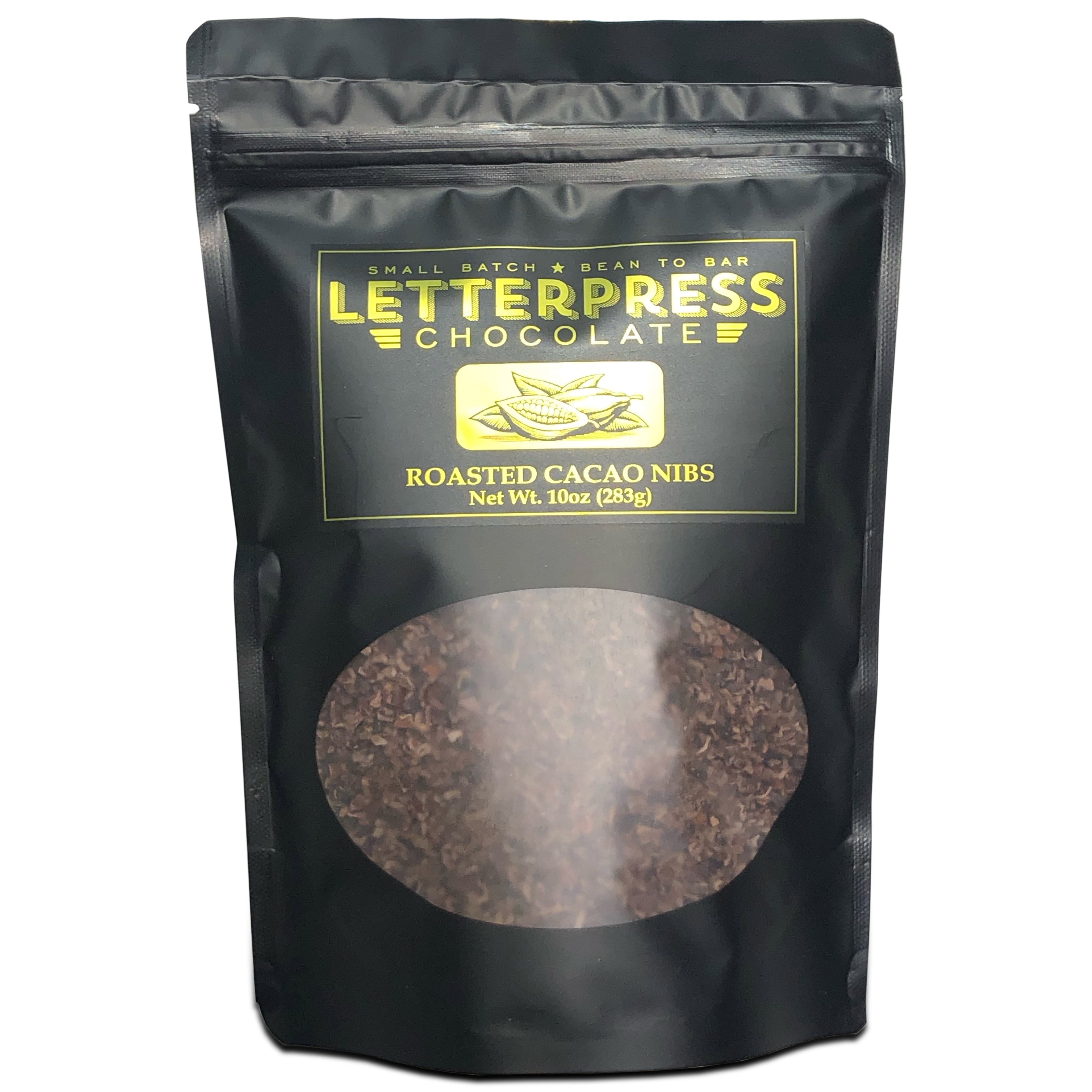 Photo of cacao nibs in black bag with transparent window showing cacao nibs inside
