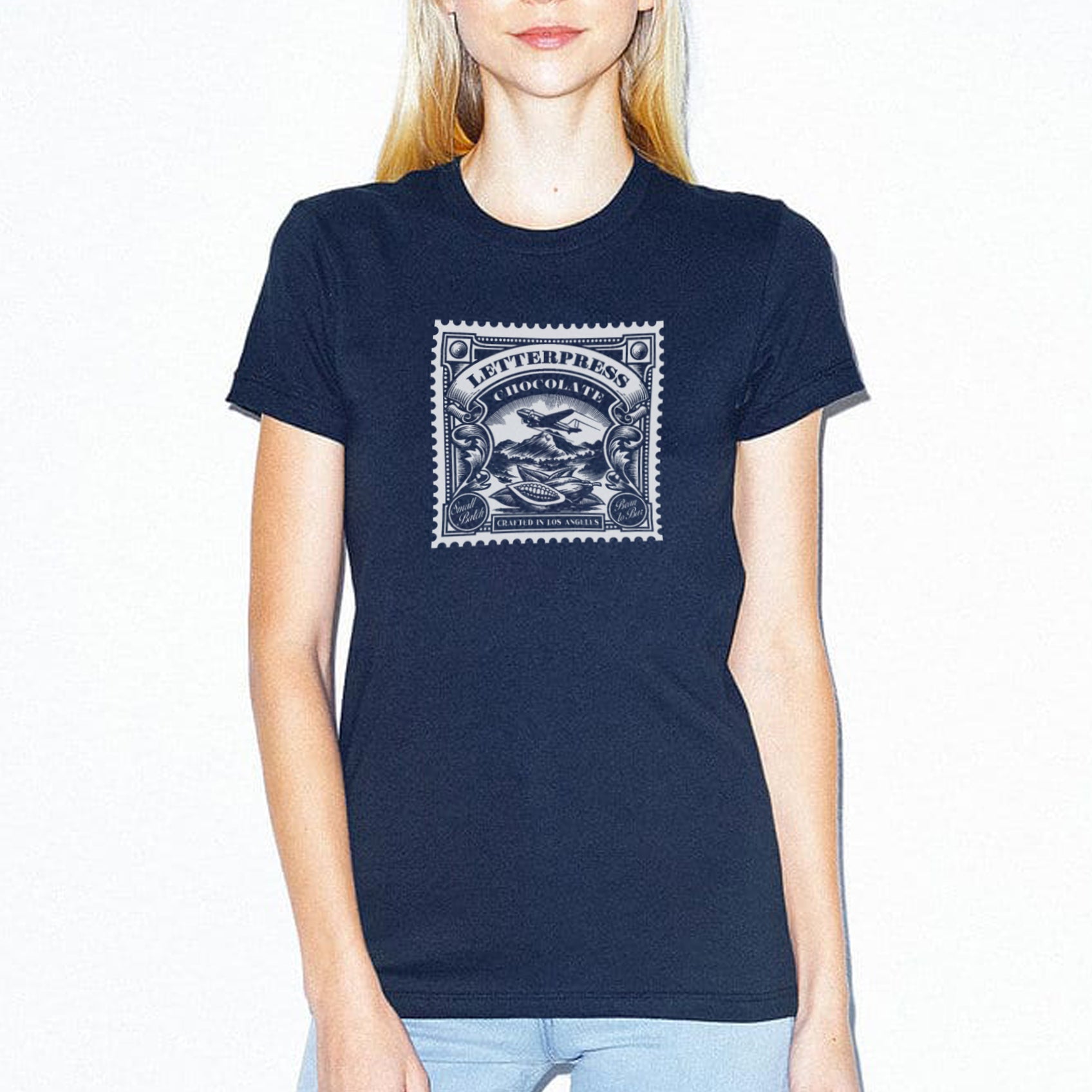 Women's navy - a woman wearing a tshirt with a white letterpress chocolate logo